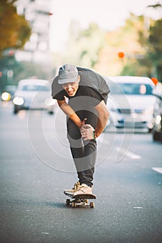 The skateboard rider on the street exhausted of riding skate