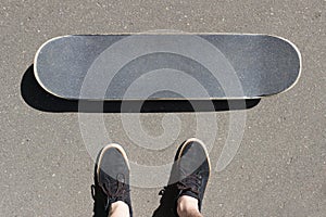 Skateboard and sneakers top view. lifestile concept. Copyspace.