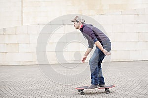 Skateboarder in action in the street.