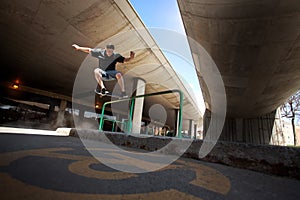 Skateboarder doing a Crooked Grind trick on a Rail