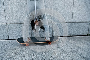 Skateboarder doing a handstand on skateboard