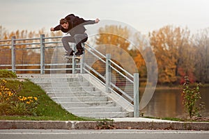 Skateboarder doing a Ollie down the stairs