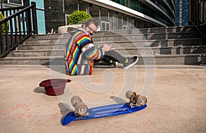 Skateboarder Falling Near Stairs in Urban Area