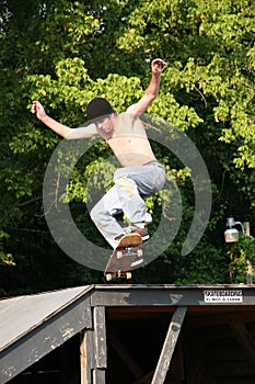 Skateboarder Going off Platform