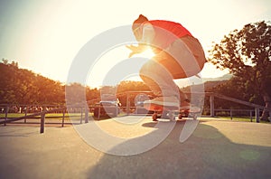 Skateboarder legs doing a track ollie