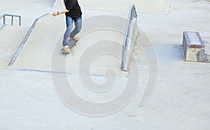 Skateboarder legs riding skateboard