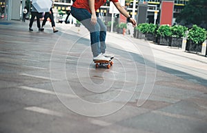 Skateboarder riding skateboard on city street