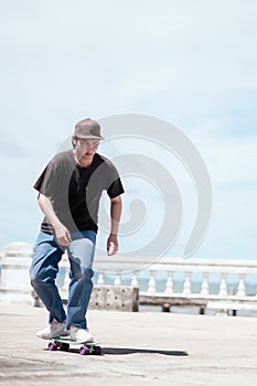 Skateboarder legs riding skateboard on sunset city