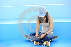 Skateboarder listening music