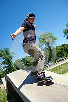 Skateboarder Rail Grinding at