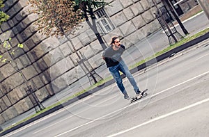 Skateboarder riding a skateboard slope on the city streets