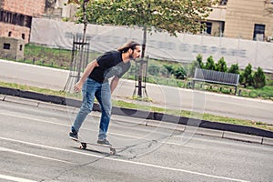 Skateboarder riding a skateboard slope on the city streets