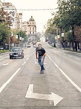 Skateboarder riding a skateboard slope on the city streets