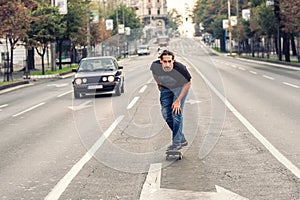 Skateboarder riding a skateboard slope on the city streets