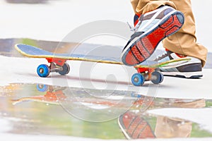 Skateboarder riding a skateboard on the street or park