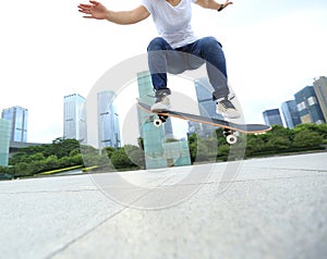 Skateboarder skateboarding at city