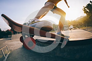 Skateboarder skateboarding on skatepark ramp