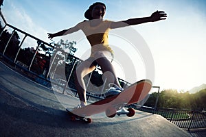 Skateboarder skateboarding on skatepark ramp