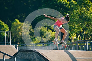 Skateboarder skateboarding on skatepark ramp