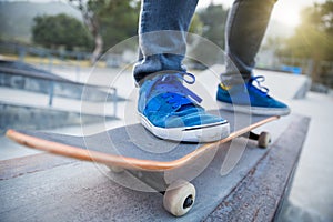 Skateboarding legs riding skateboard