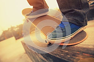 Skateboarding legs riding on a skateboard