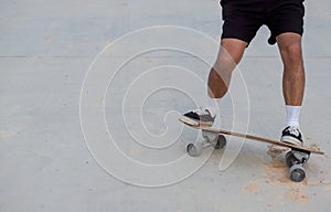 Skateboarding on road surface with dirt and sand. Can cause an accident to slip and fall
