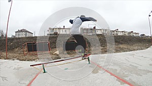 Skateboarding teenager man in skatepark extreme sport in slow motion 4K. Taken on Gopro 6 black