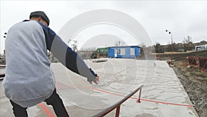 Skateboarding teenager man in skatepark extreme sport in slow motion 4K. Taken on Gopro 6 black