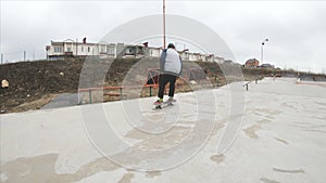 Skateboarding teenager man in skatepark extreme sport in slow motion 4K. Taken on Gopro 6 black