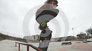 Skateboarding teenager man in skatepark extreme sport in slow motion 4K. Taken on Gopro 6 black