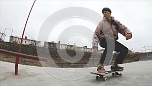 Skateboarding teenager man in skatepark extreme sport in slow motion 4K. Taken on Gopro 6 black