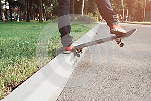 Skateboarding tricks of young hipster man