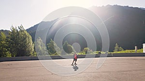 Skatebording at longboard in the mountain road