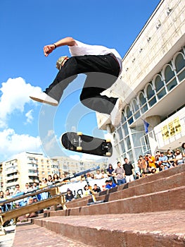 Skater 360 Flipping at a Contest photo