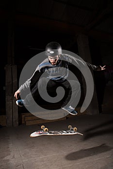 Skater doing kickflip trick photo