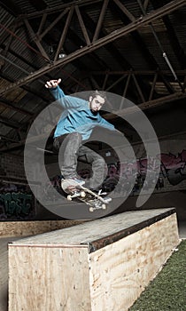 Skater doing ollie down hubba ledge