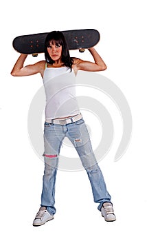 Skater girl holding skateboard behind her head