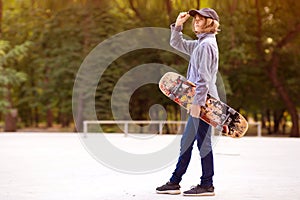 Skater girl on skatepark moving on skateboard outdoors