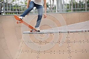 Skater legs skating on ramp