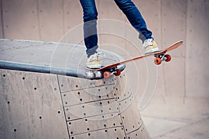 Skater legs skating on ramp