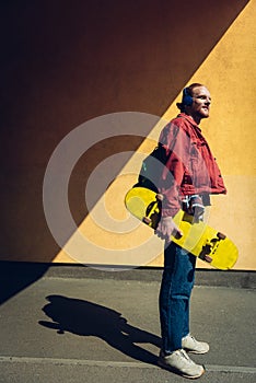 Skater man listen to music via headphones