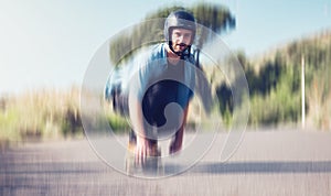 Skater, motion blur and speed with a sports man skating on an asphalt road outdoor for recreation. Skate, soft focus and