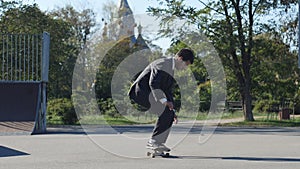 Skater in a suit goes the trick FS Pop Shove-it skate park