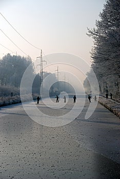 Skaters on frozen river