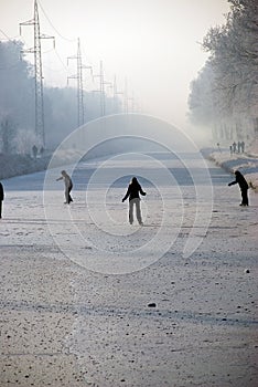 Skaters on frozen river