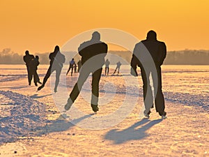 Skaters during sunset photo