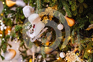 skates. part of the Christmas tree with vintage toys and an electric garland.