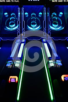 Skee-Ball Arcade Game Lit Up with Neon Lights