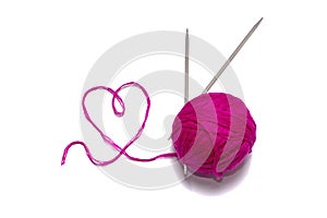 Skein of wool pink with spokes and thread in the shape of a heart on a white background