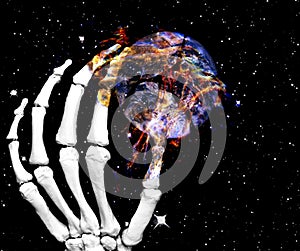 Skeletal hand with planet earth